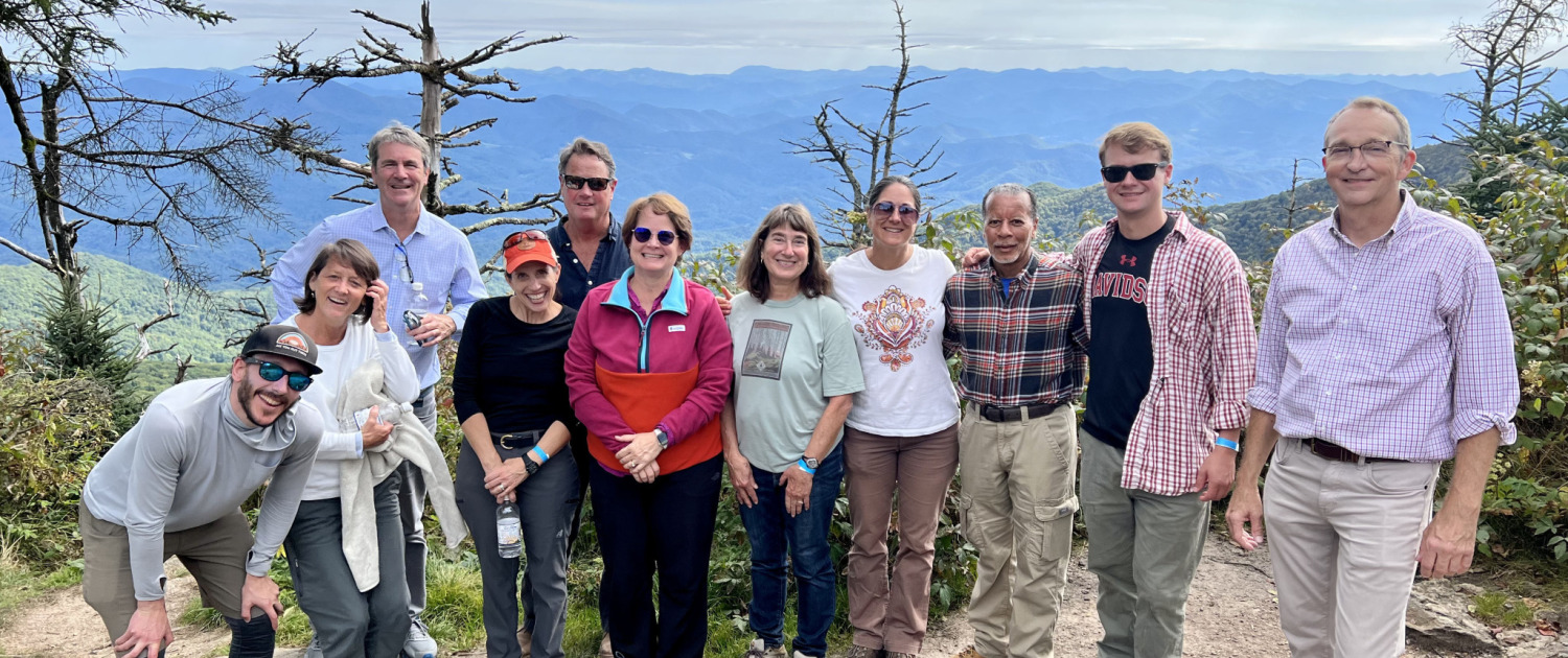 Board and staff and waterrock knob Hikers at waterrock knob overlook