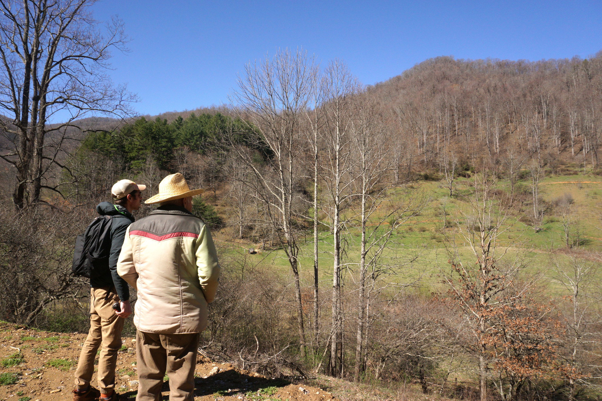 Trey and Vance Garrett looking at Sandy Mush Creek